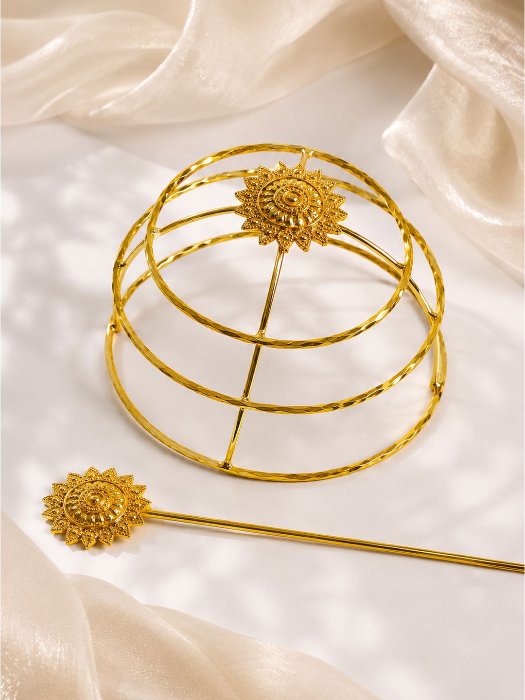 Close-up of blazing sun-design bun cage lock detail in gold-finish brass