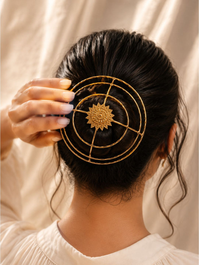 Gold-finish brass sun-design bun cage hair accessory with decorative locking pin